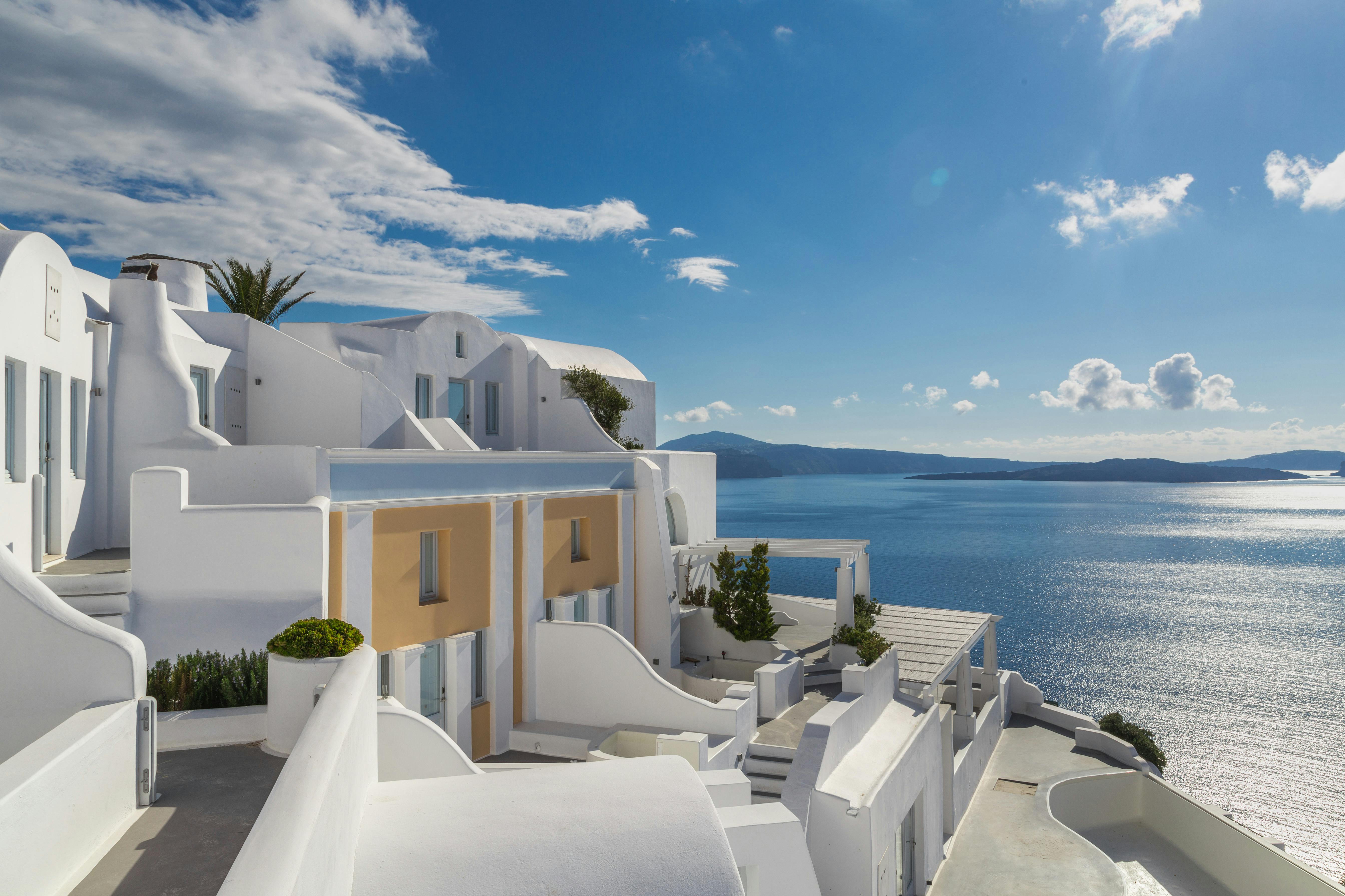 White and blue houses overlooking the Aegean Sea in Santorini